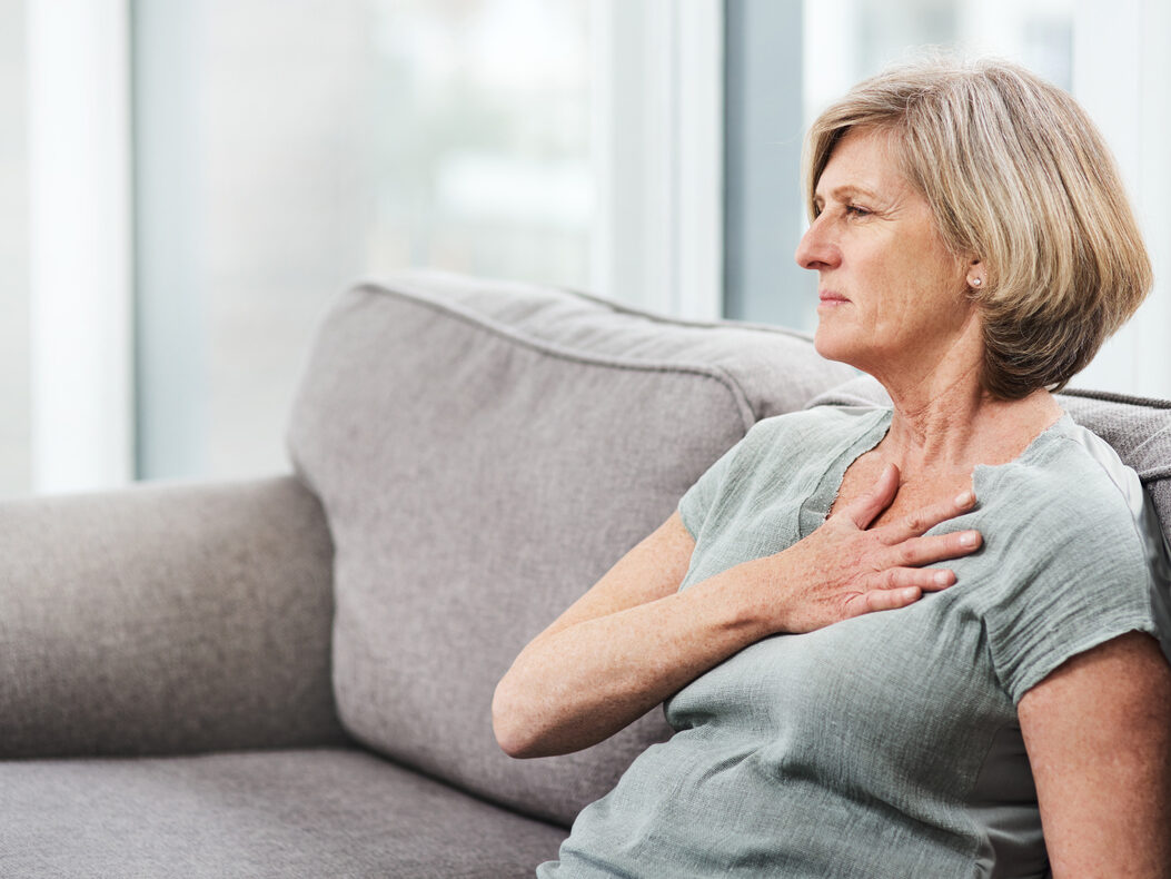senior woman suffering from chest pain